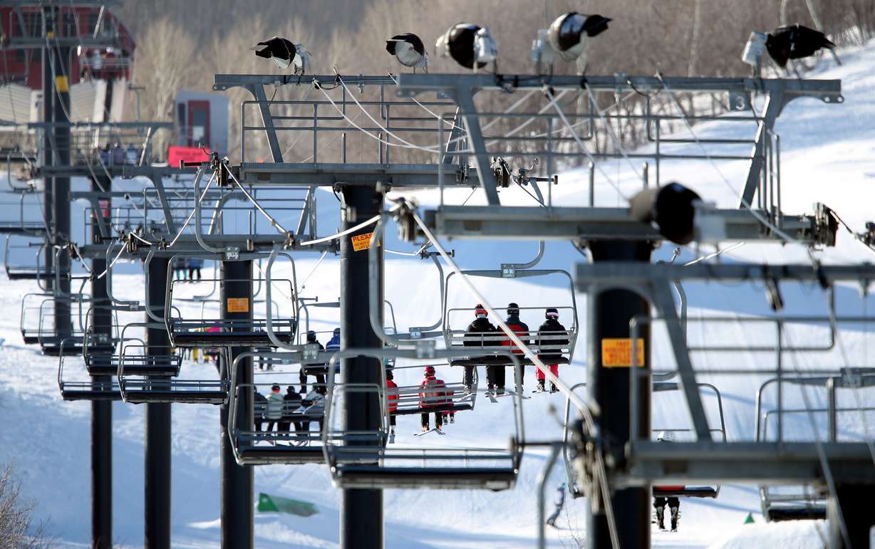 Skiers and snowboarders ride up the mountain at Park City Mountain Resort on Jan. 11, 2022.