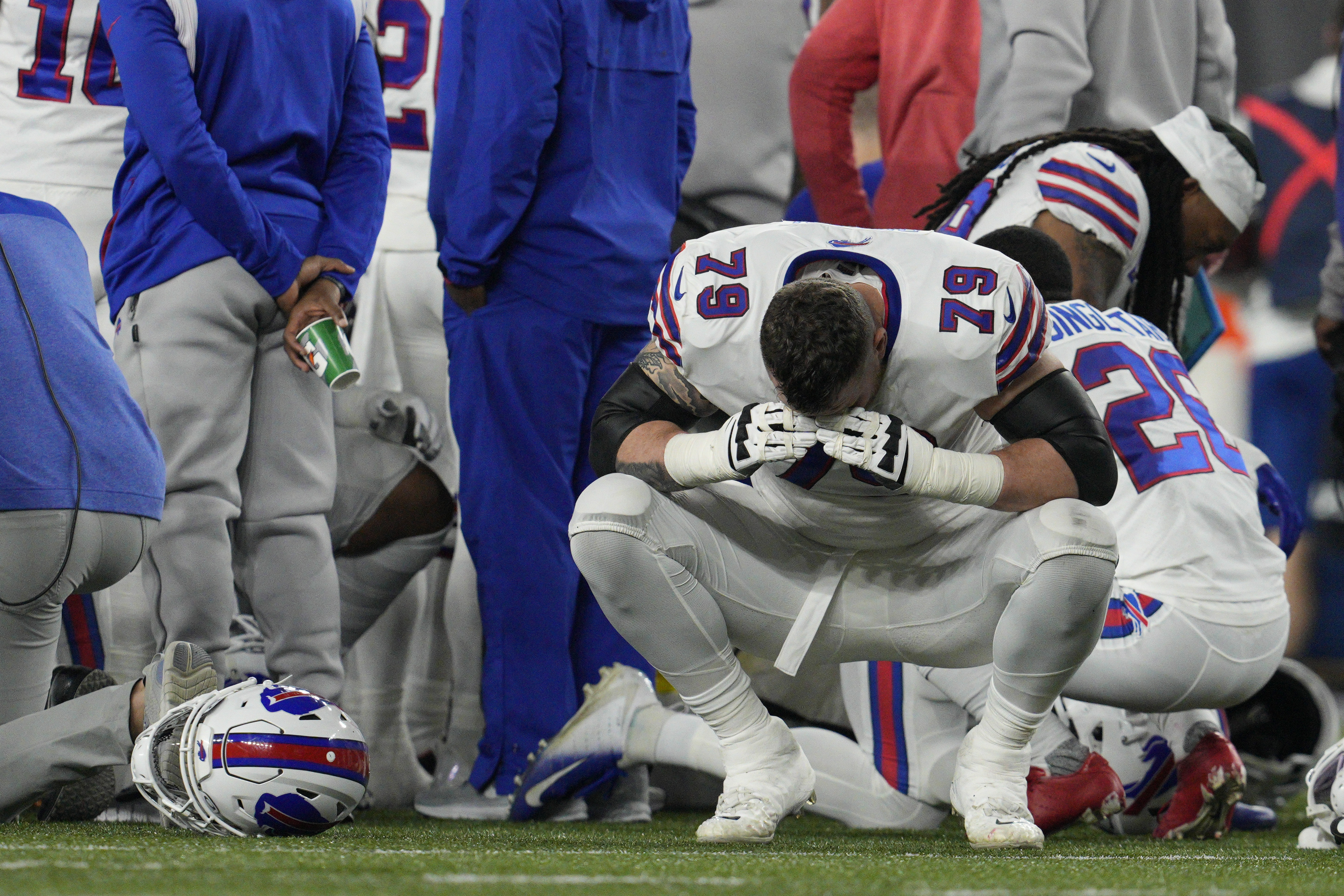 Buffalo Bills' Spencer Brown (79) reacts as teammate Damar Hamlin is examined during an NFL football game against the Cincinnati Bengals, Monday, in Cincinnati.