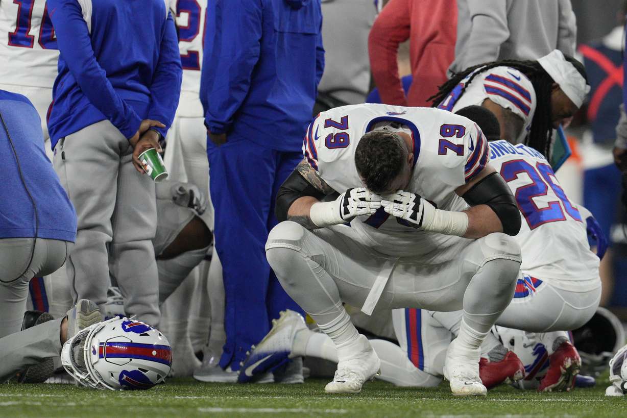 Buffalo Bills' Spencer Brown (79) reacts as teammate Damar Hamlin is examined during an NFL football game against the Cincinnati Bengals, Monday, in Cincinnati.