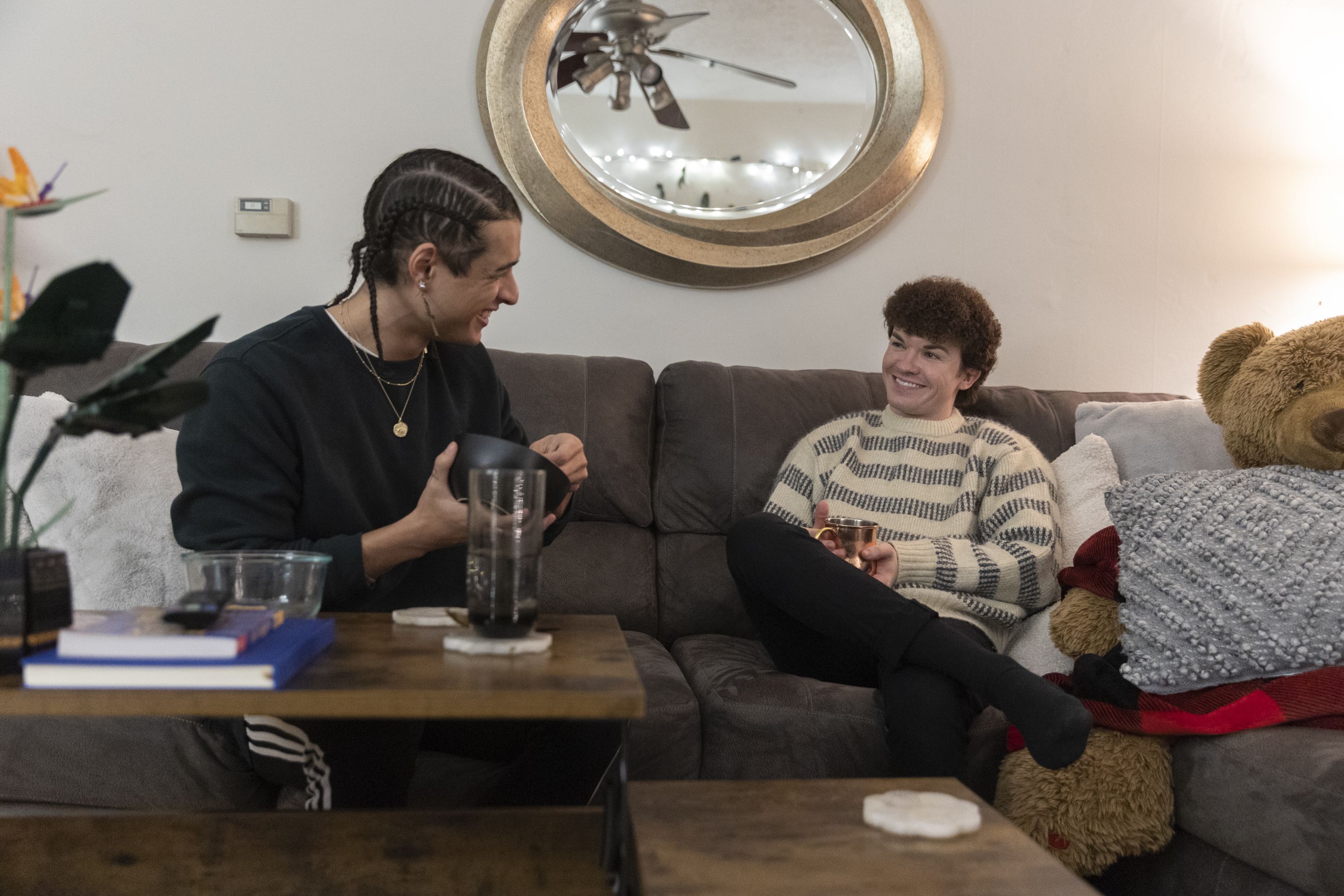 Scotty Fletcher, left, and his partner Joseph Branca hang out in their living room in the apartment they rent in Salt Lake City on Thursday.
