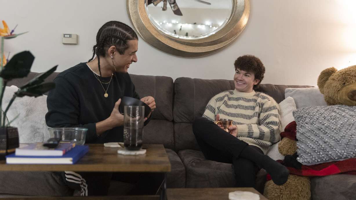 Scotty Fletcher, left, and his partner Joseph Branca hang out in their living room in the apartment they rent in Salt Lake City on Thursday.