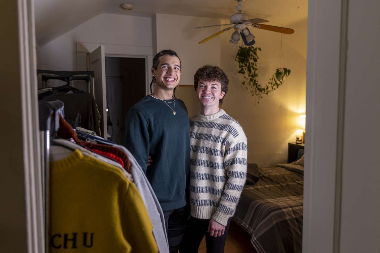 Scotty Fletcher, left, and his partner Joseph Branca pose for a photo in their apartment they rent in Salt Lake City on Thursday.