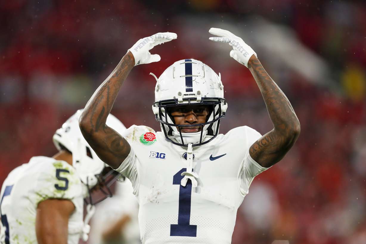 The Penn State Nittany Lions' KeAndre Lambert-Smith (1) gestures towards the crowd while playing the Utah Utes in the 109th Rose Bowl in Pasadena on Monday, Jan. 2, 2023. The Penn State Nittany Lions won 35-21.