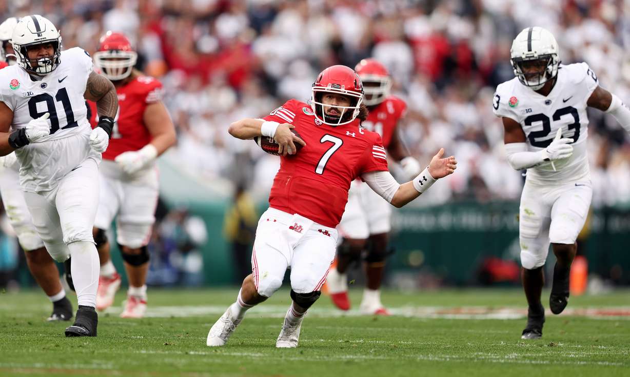 Utah Utes QB Cameron Rising (7) begins a slide during a run as Utah and Penn State play in the Rose Bowl in Pasadena, California, on Monday, Jan. 2, 2023.
