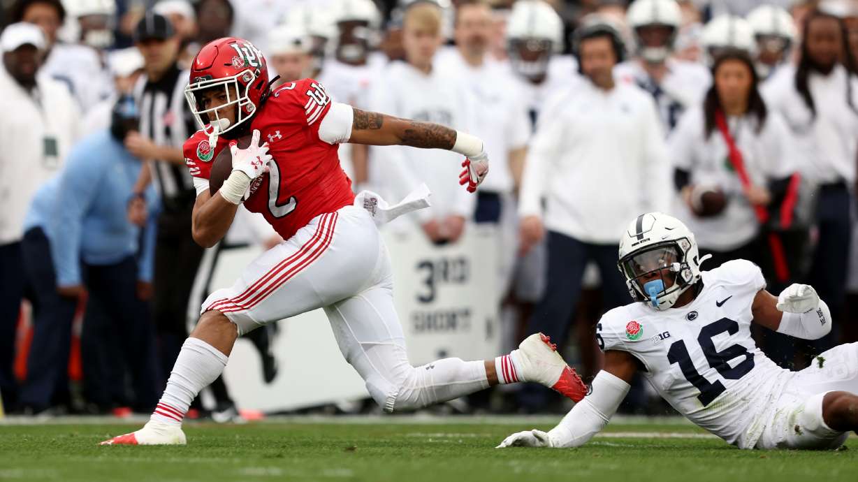Utah Utes RB Micah Bernard (2) fights to regain his balance as Utah and Penn State play in the Rose Bowl in Pasadena, California, on Monday, Jan. 2, 2023.