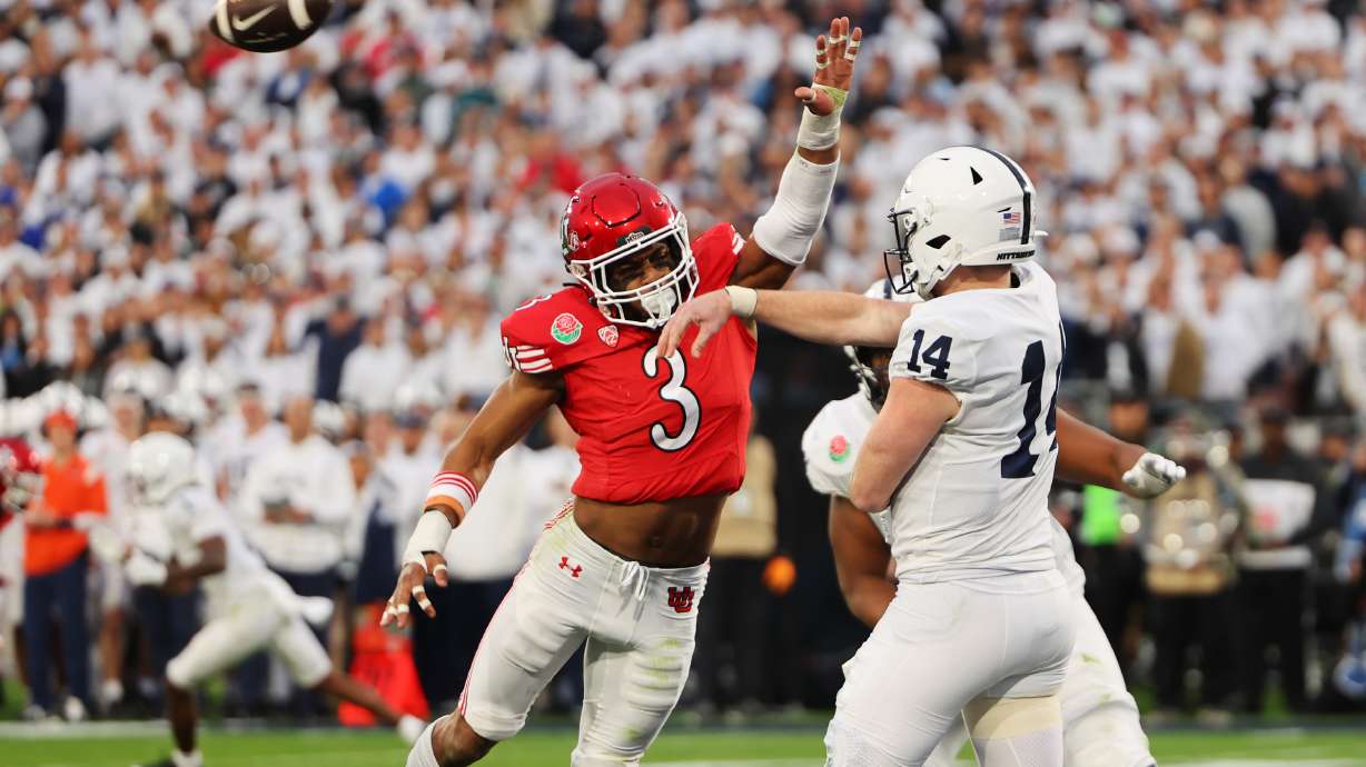 Utah Utes LB Mohamoud Diabate (3) tries to knock the ball down as Penn State Nittany Lions QB Sean Clifford (14) passes as Utah and Penn State play in the Rose Bowl in Pasadena, California, on Monday, Jan. 2, 2023. Penn State won 35-21.
