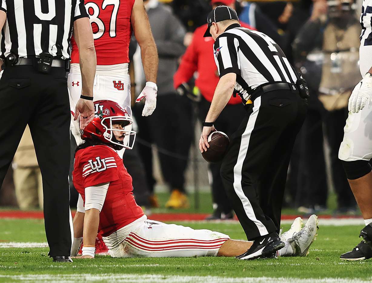 Utah Utes QB Cameron Rising (7) sits on the field after getting injured as Utah and Penn State play in the Rose Bowl in Pasadena, California, on Monday, Jan. 2, 2023. Penn State won 35-21.