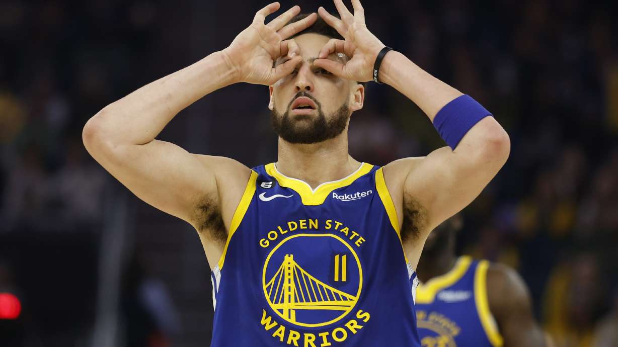 Golden State Warriors guard Klay Thompson (11) celebrates after a making a 3-point basket against the Atlanta Hawks during the first half of an NBA basketball game in San Francisco, Monday, Jan. 2, 2023.