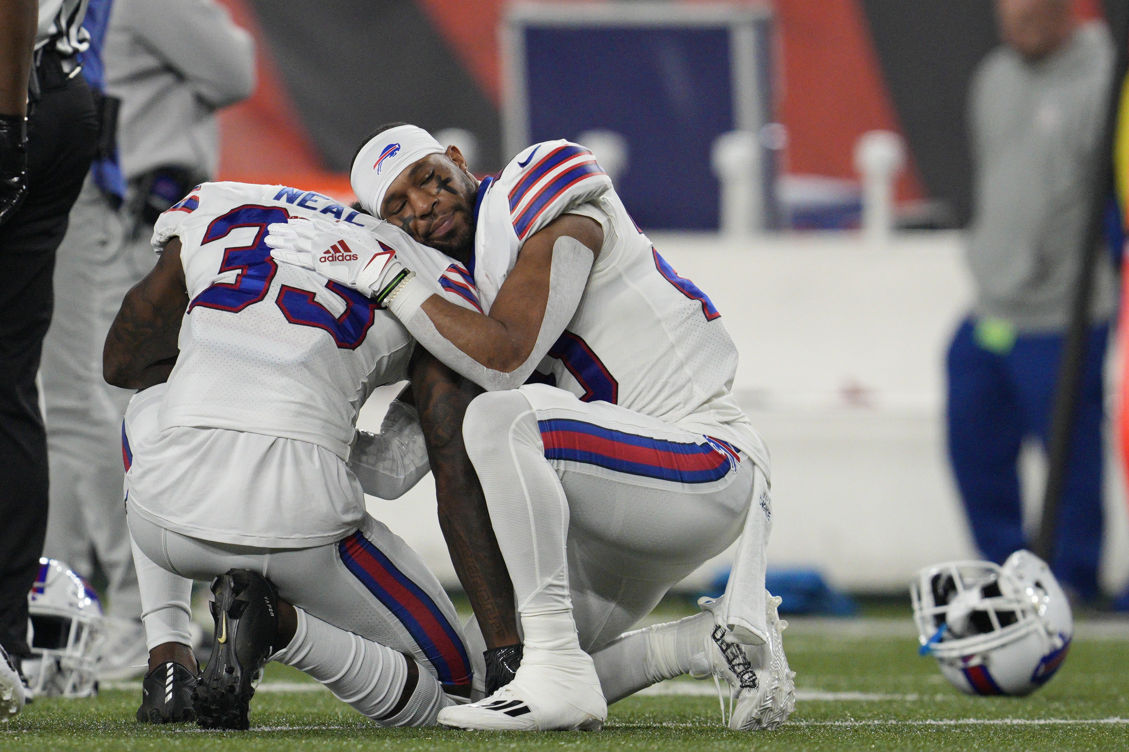 Buffalo Bills' Siran Neal (33) and Nyheim Hines react after teammate Damar Hamlin was injured during the first half of an NFL football game against the Cincinnati Bengals, Monday, Jan. 2, 2023, in Cincinnati. 
