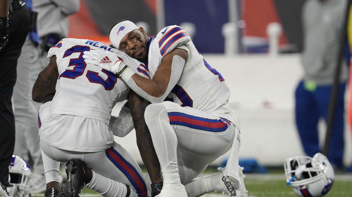 Buffalo Bills' Siran Neal (33) and Nyheim Hines react after teammate Damar Hamlin was injured during the first half of an NFL football game against the Cincinnati Bengals, Monday, Jan. 2, 2023, in Cincinnati.