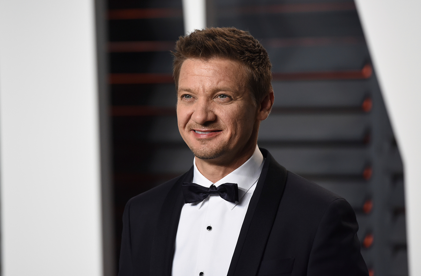 Jeremy Renner, pictured in 2016 in Beverly Hills, California, is in ICU recovering from two surgeries after being injured in snow plowing incident.