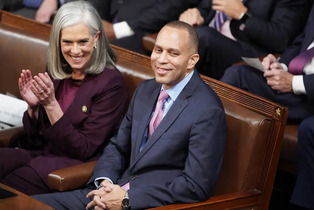 Incoming Democratic Whip Rep. Katherine Clark, D-Mass., left, sits with Rep. Hakeem Jeffries, D-N.Y., during the vote to determine the next House Minority Leader in the House chamber on the opening day of the 118th Congress at the U.S. Capitol, Tuesday in Washington.