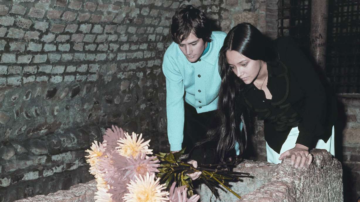 Olivia Hussey and Leonard Whiting, who played the title roles in Franco Zeffirelli's "Romeo and Juliet," place flowers on the "Tomba di Giulietta," or the Tomb of Juliet, in Verona, northern Italy, on Oct. 22, 1968. The two stars of the movie sued Paramount Pictures for more than $500 million on Tuesday over a nude scene in the film shot when they were teens.