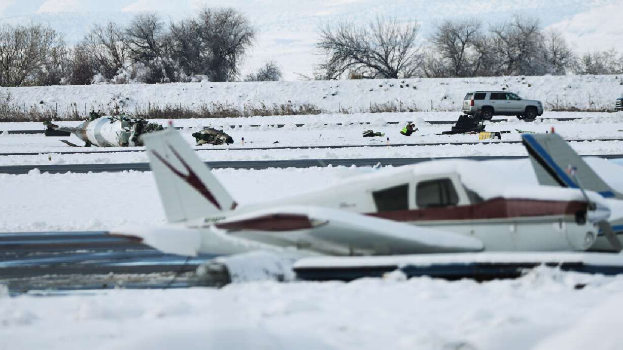Investigators continue looking over the scene in Provo on Tuesday after pilot Nathan Ricks was killed instantly during a takeoff at Provo Airport. The airport is expected to reopen at 4 pm Wednesday.