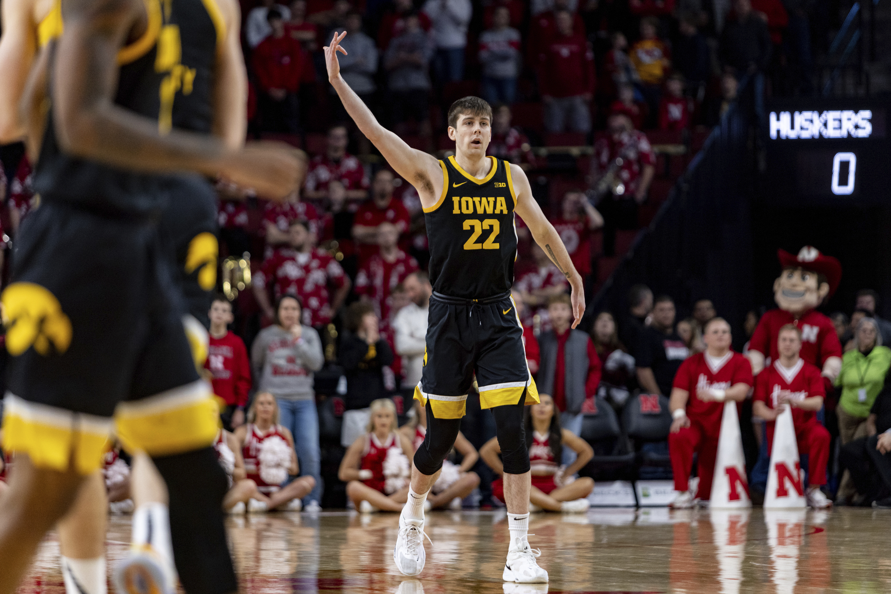 Iowa's Patrick McCaffery (22) celebrates after his 3-point basket against Nebraska in the first half during an NCAA college basketball game Thursday, Dec. 29, 2022, in Lincoln, Neb.