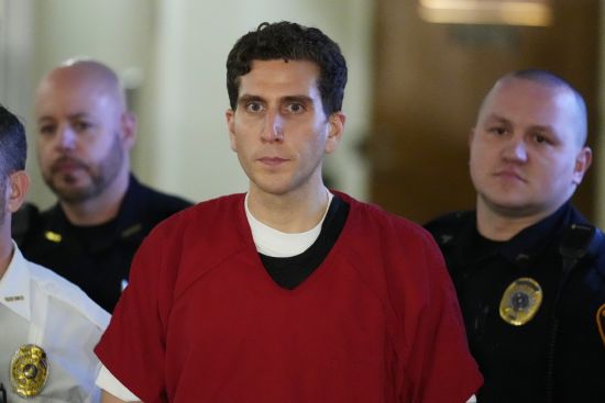 Bryan Kohberger, who is accused of killing four University of Idaho students, is escorted to an extradition hearing at the Monroe County Courthouse in Stroudsburg, Pa., Tuesday.