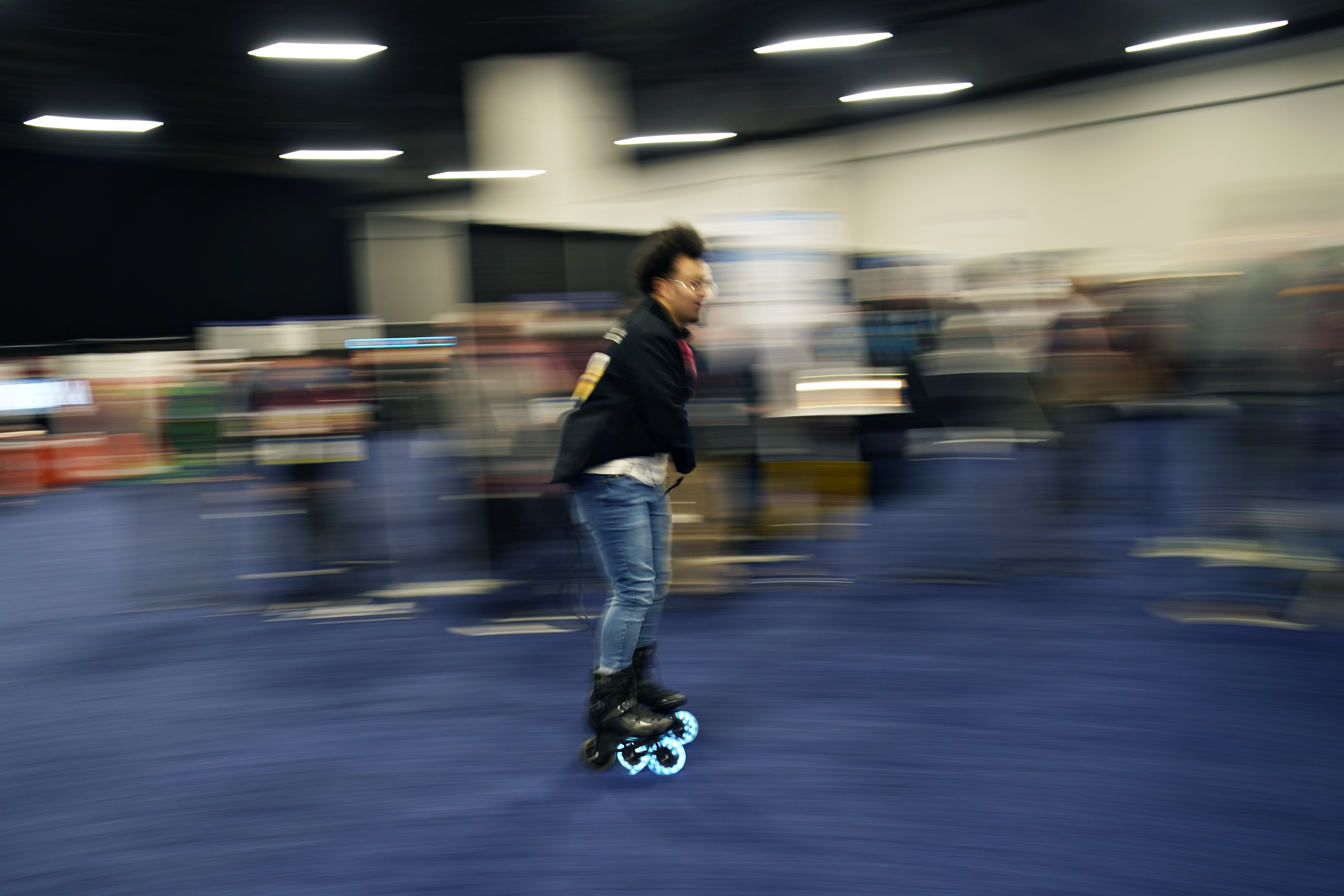 Mohamed Soliman of Atmos Gear shows off the Atmos Gear inline electric skates during CES Unveiled before the start of the CES tech show, Tuesday in Las Vegas. 