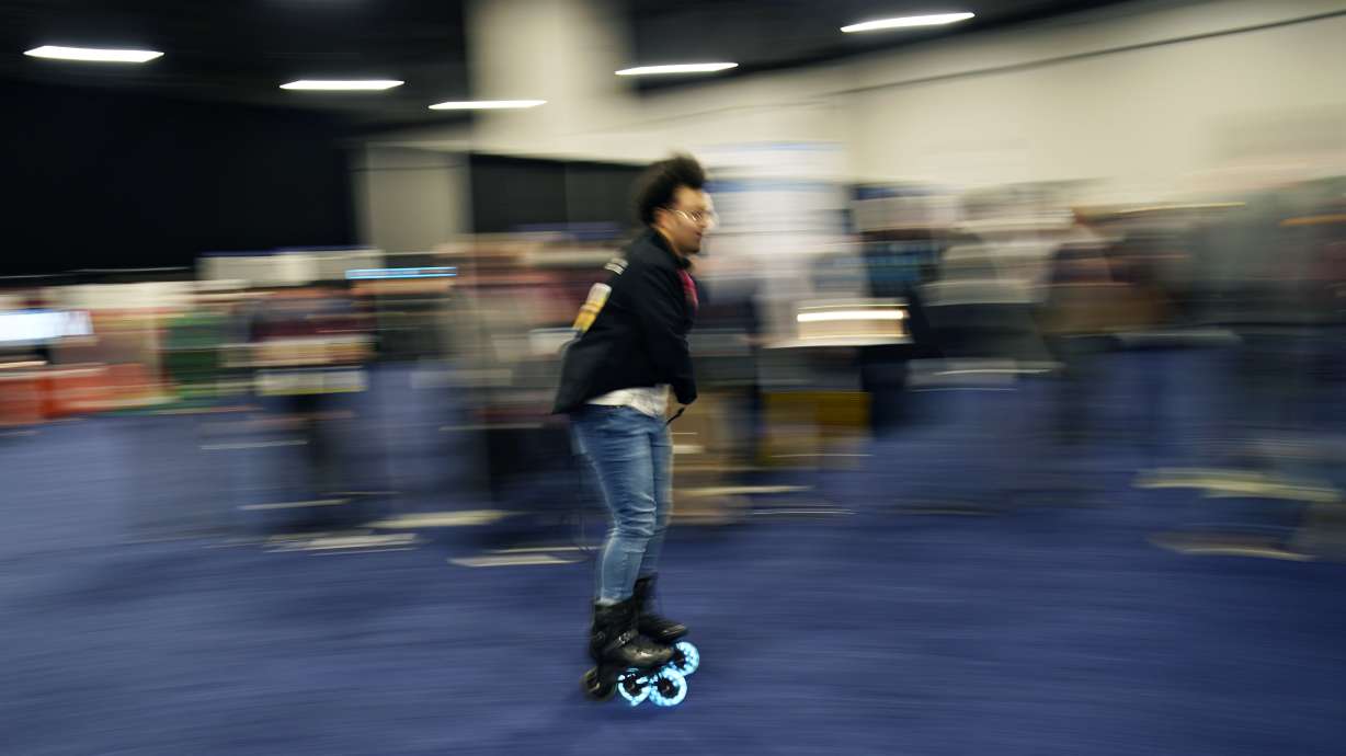 Mohamed Soliman of Atmos Gear shows off the Atmos Gear inline electric skates during CES Unveiled before the start of the CES tech show, Tuesday in Las Vegas.