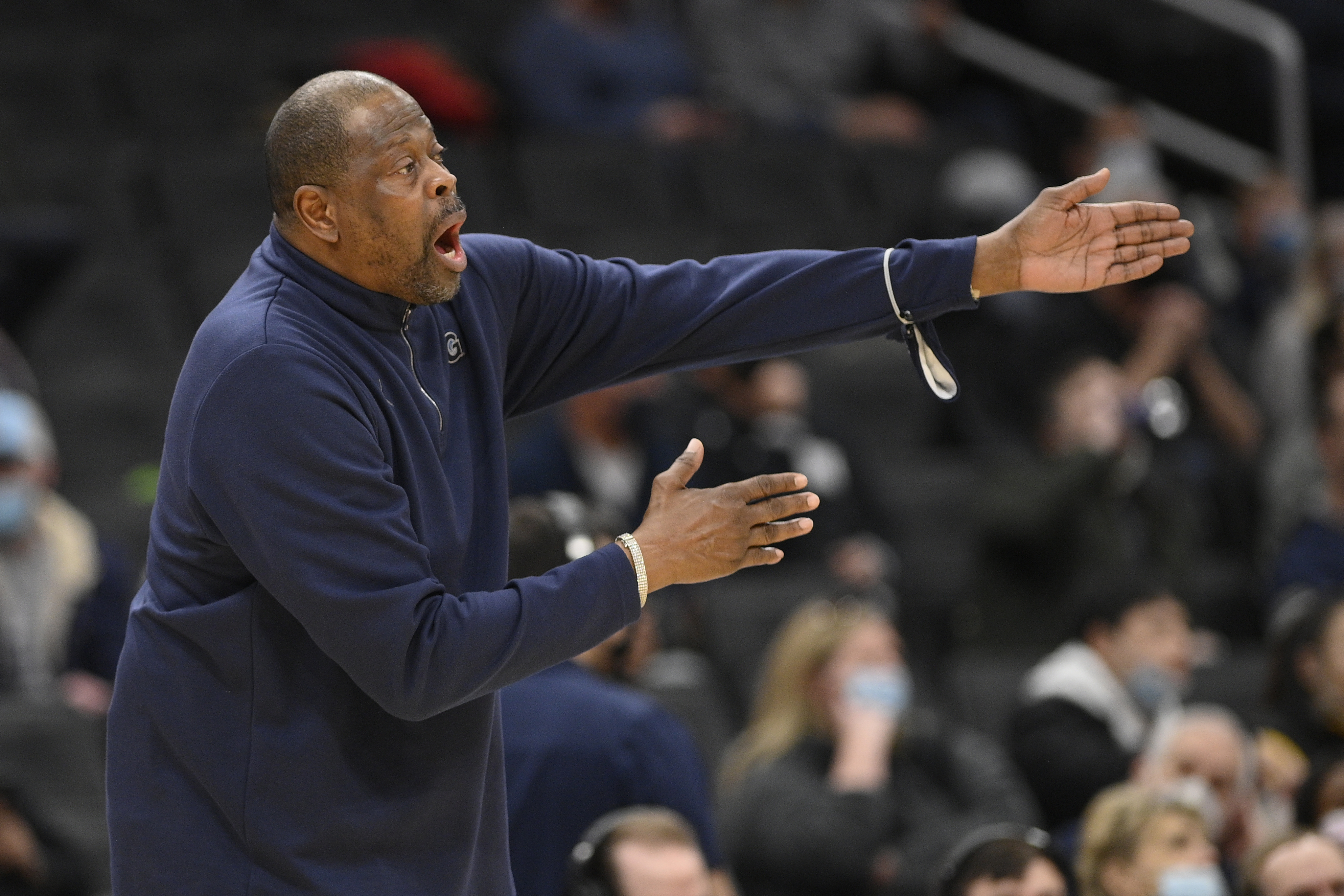 FILE - Georgetown head coach Patrick Ewing reacts during the first half of an NCAA college basketball game against Connecticut, Sunday, Feb. 27, 2022, in Washington. Georgetown basketball coach Patrick Ewing's loss-filled stint at his alma mater was called a “challenging and frustrating time" by athletic director Lee Reed, who added Wednesday, Jan. 4, 2023, that “no one is more committed” to turning things around than the former star center. 