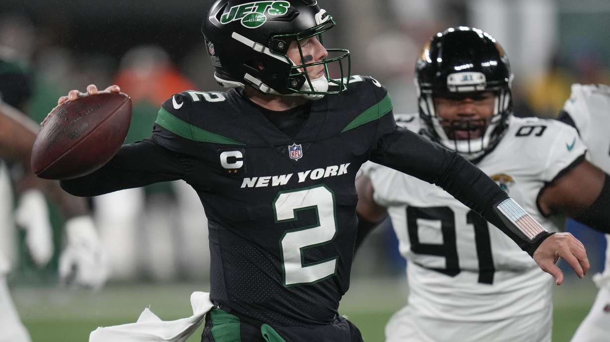 New York Jets quarterback Zach Wilson (2) passes against the Jacksonville Jaguars during the first quarter of an NFL football game, Thursday, Dec. 22, 2022, in East Rutherford, N.J.