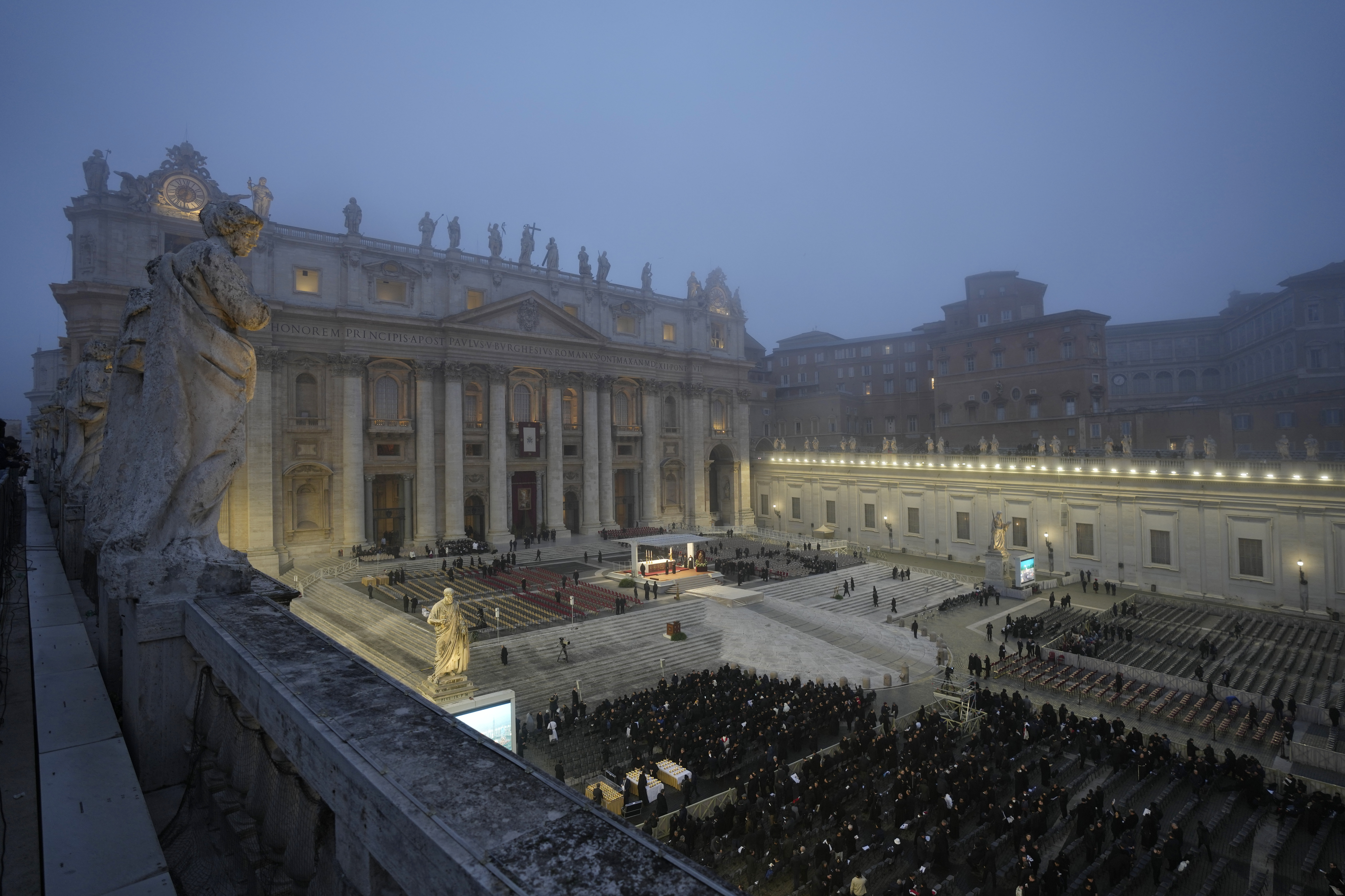 People gather in St. Peter's Square at the Vatican ahead of the funeral mass for late Pope Emeritus Benedict XVI, Thursday.