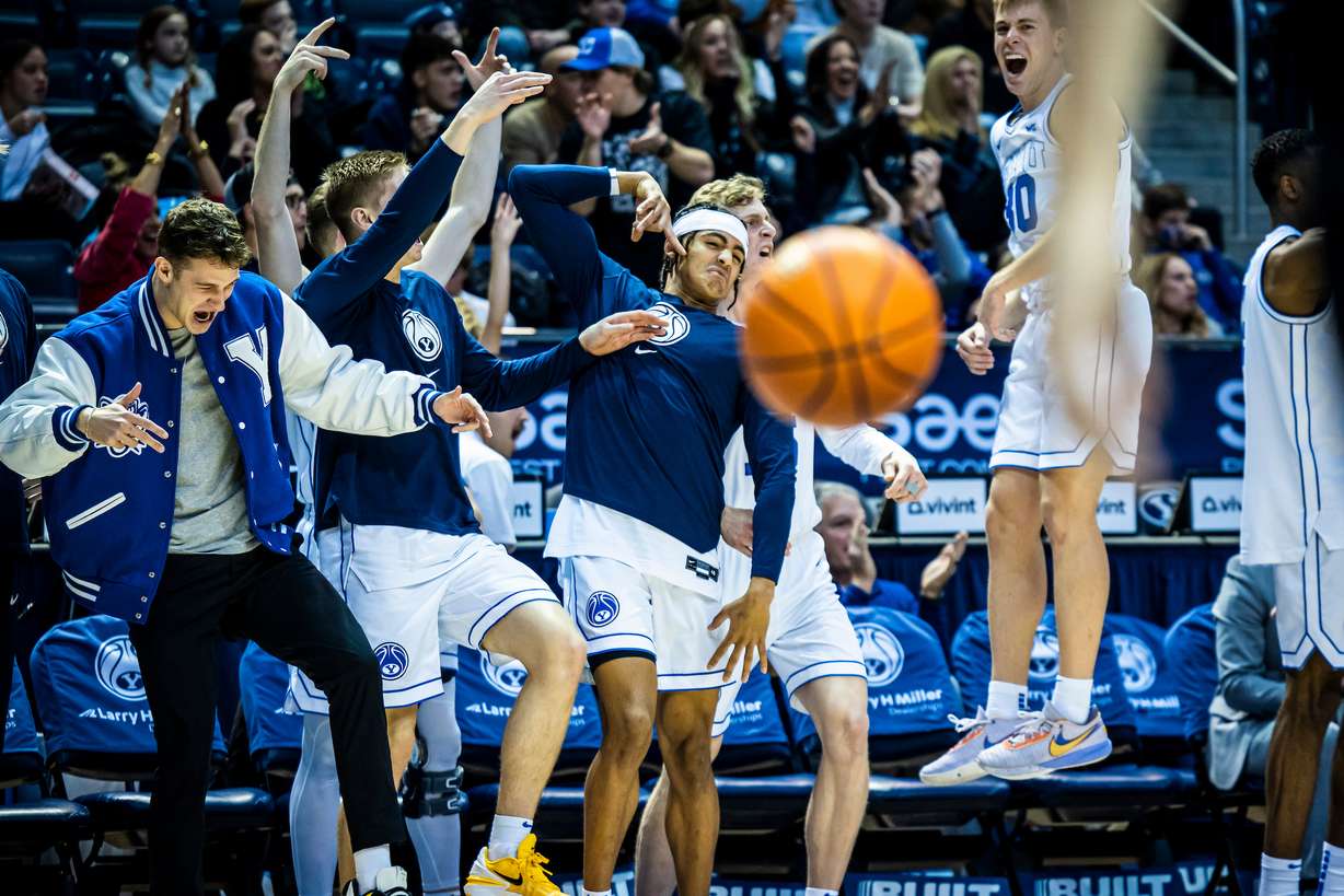 BYU guard Trevin Knell, left, celebrates a bucket with guard Trey Stewart during the Cougars' 71-58 win over Portland, Dec. 31, 2022 at the Marriott Center in Provo.