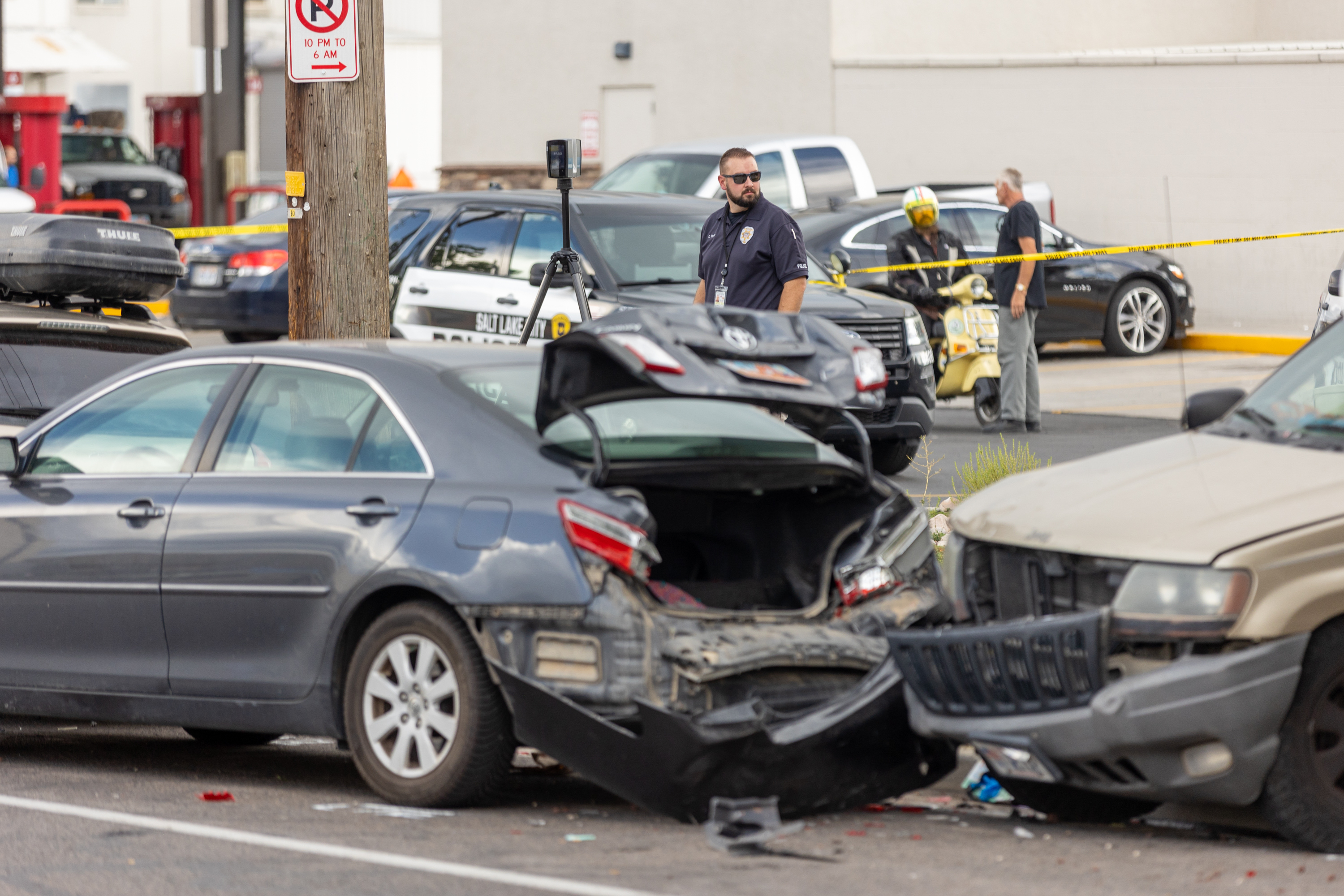 An officer investigates a car crash that involved five vehicles near 450 S. 400 West in Salt Lake City on Aug. 12, 2022. Utah transportation officials said 320 people were killed on Utah roads in 2022, the second most since 2003.