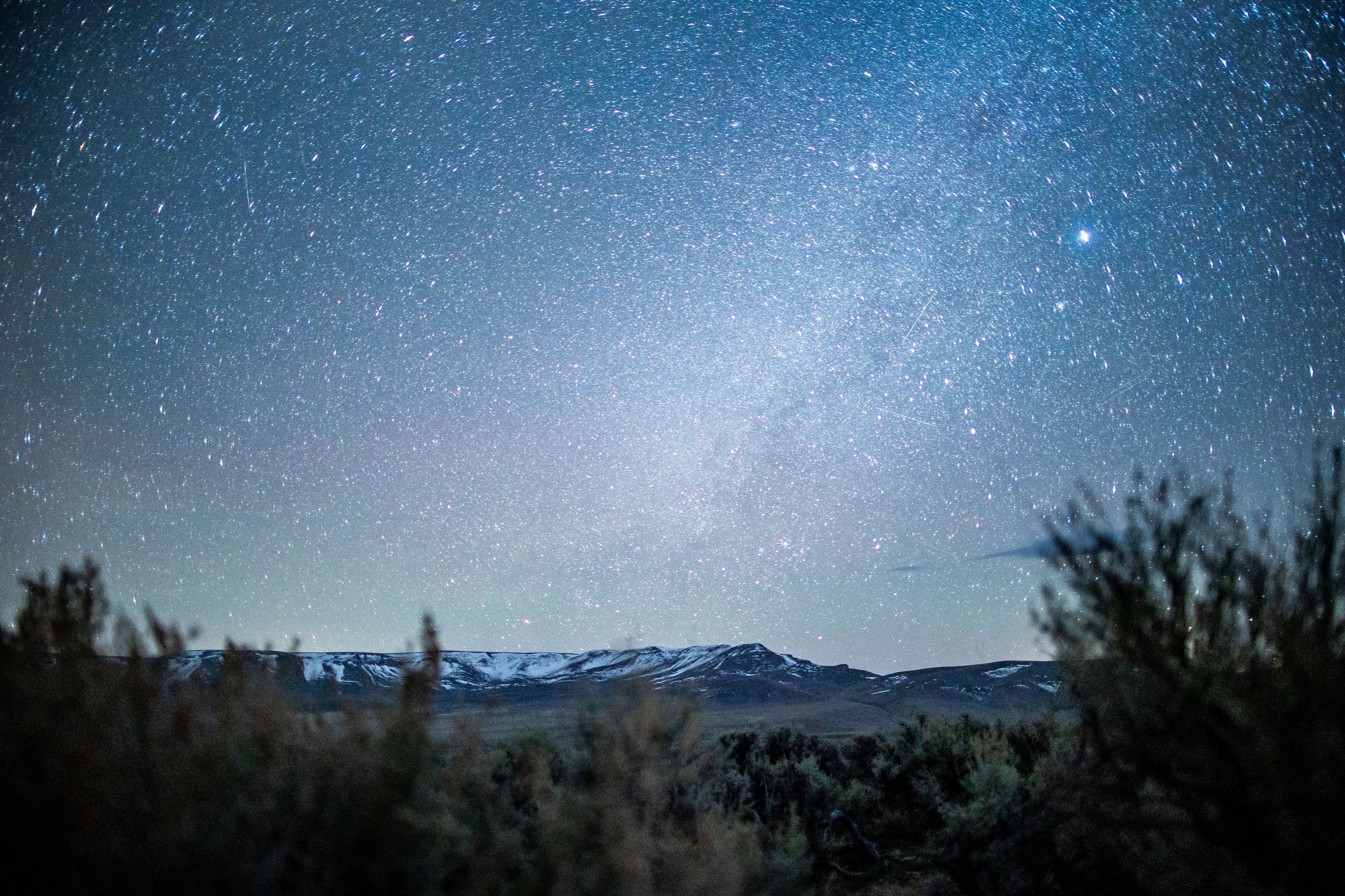 Starlight illuminates the sagebrush and mountains near the site of a proposed lithium mine at Thacker Pass, Nevada, on April 1, 2021. A western mining project for green energy resources is at the center of a court struggle where multiple parties are involved.