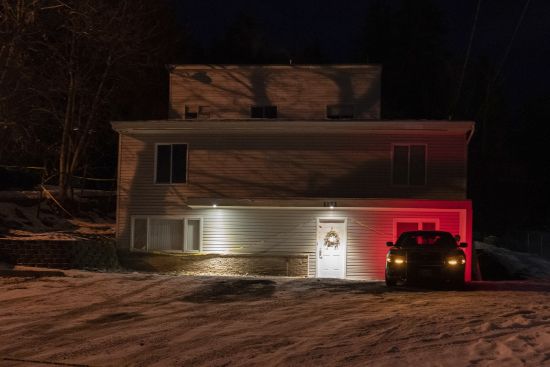 A private security officer sits in a vehicle, Tuesday in front of the house in Moscow, Idaho where four University of Idaho students were killed in November, 2022. Authorities said Wednesday, Jan. 4, that Bryan Kohberger, the man accused in the killings, has left a Pennsylvania jail in the custody of state police. The move means Kohberger could be headed to Idaho to face first-degree murder charges.