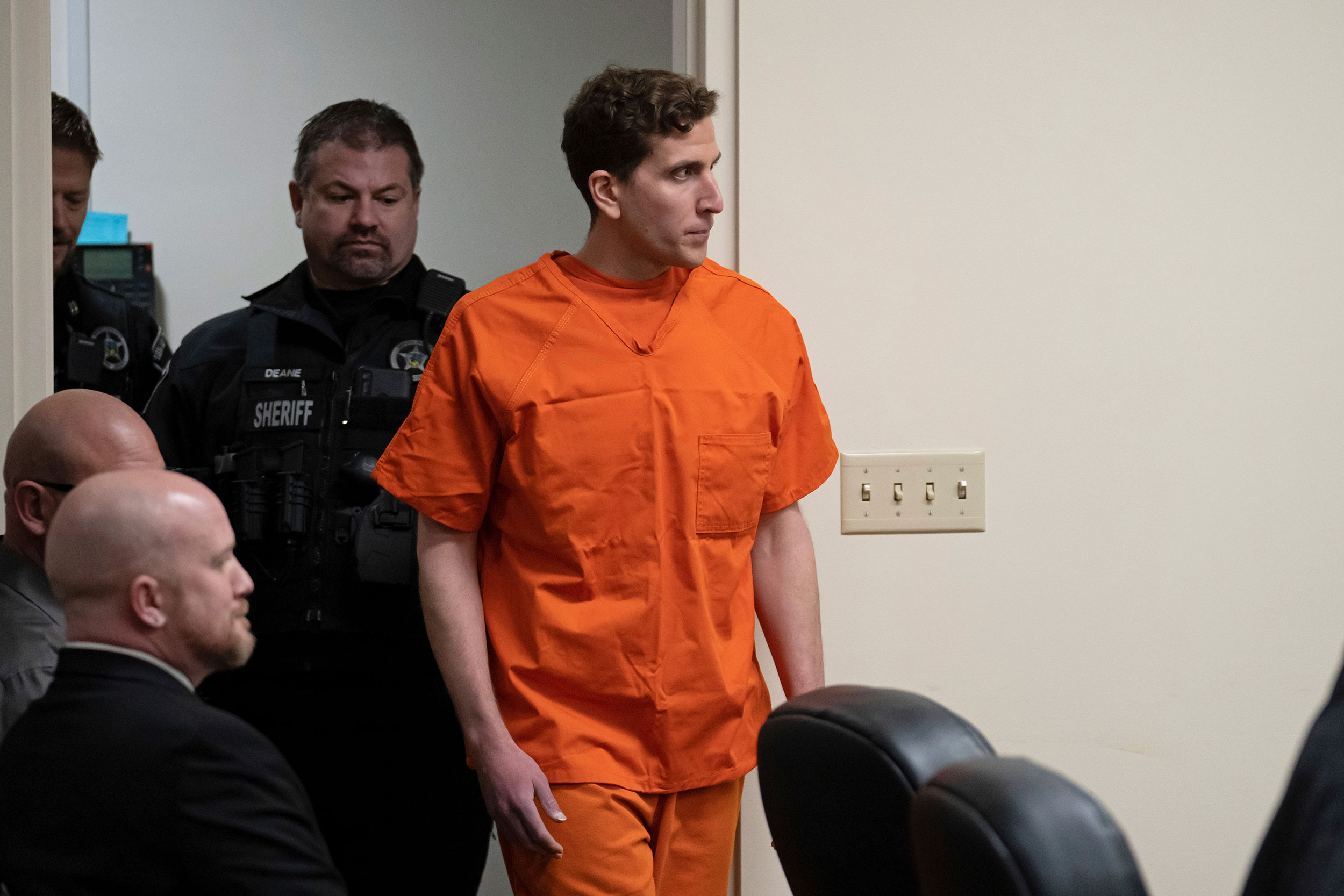 Bryan Kohberger, right, who is accused of killing four University of Idaho students in November 2022, had thoroughly cleaned his car and was also seen wearing surgical gloves before being apprehended, a law enforcement source says.
