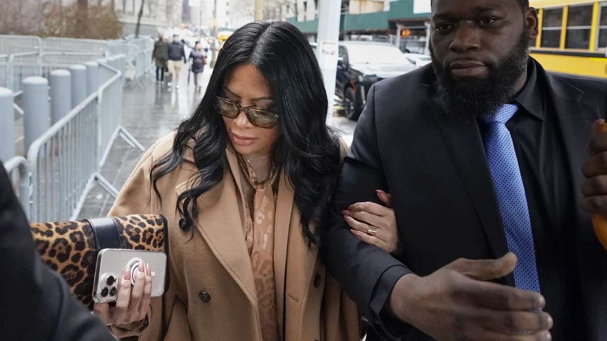 Jennifer Shah arrives to federal court in New York, Friday. A judge sentenced "The Real Housewives of Salt Lake City" cast member, who prosecutors say lived lavishly after defrauding thousands of people nationwide.