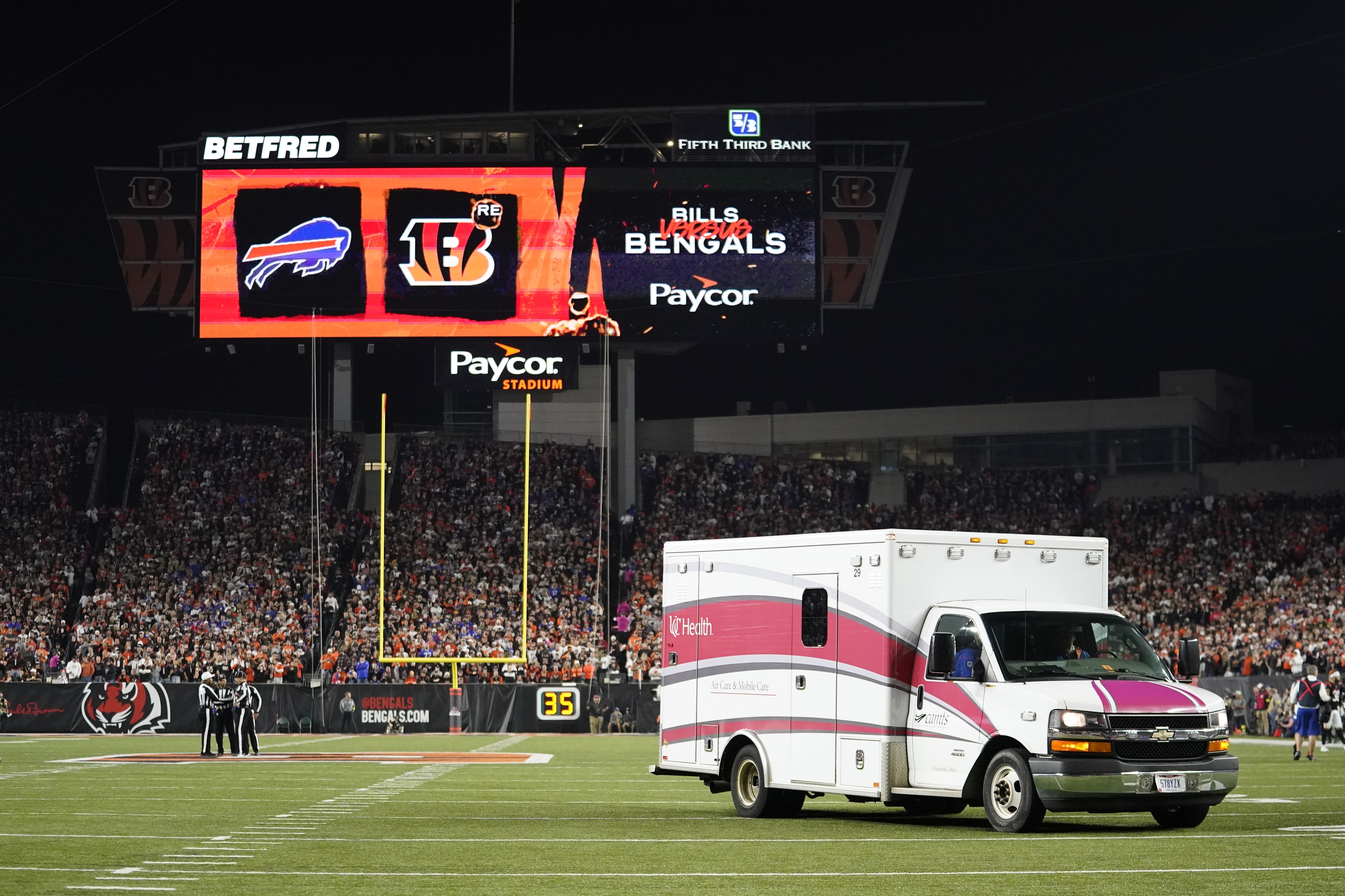 An ambulance leaves the field with Buffalo Bills' Damar Hamlin on Monday in Cincinnati. Doctors say early intervention from medical staff on the field helped save Hamlin's life.