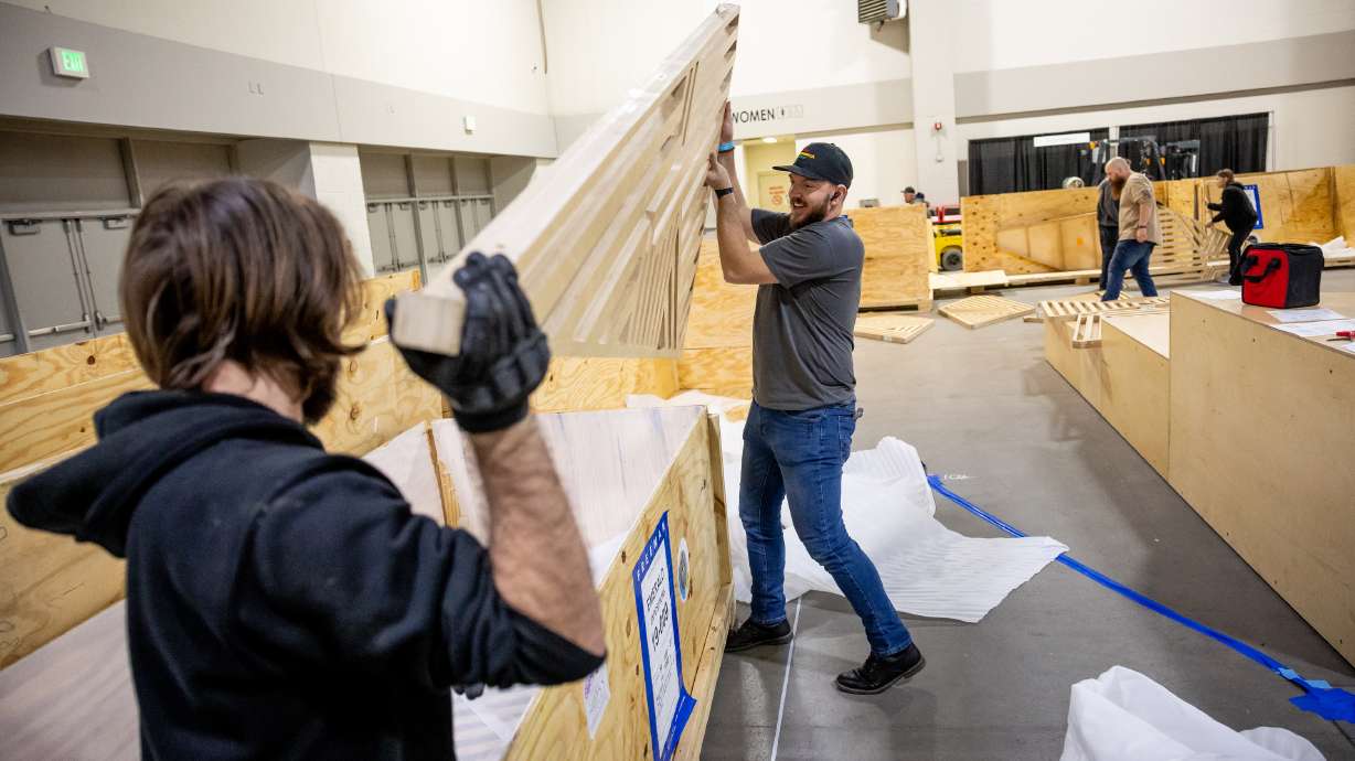 Kevin Thomas, left, and Cody Young work with other members of the IATSE Local 99 union to set up for the Outdoor Retailer show at the Salt Palace Convention Center in Salt Lake City on Thursday. Outdoor Retailer returns Monday with a pair of events ahead of the main trade show that runs next Tuesday through Thursday.