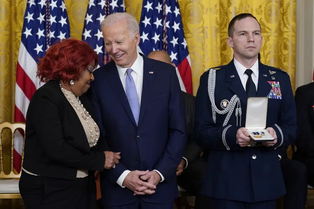 President Joe Biden speaks with Ruby Freeman before awarding her the Presidential Citizens Medal, the nation's second-highest civilian honor, during a ceremony to mark the second anniversary of the Jan. 6 assault on the Capitol in the East Room of the White House in Washington, Friday.