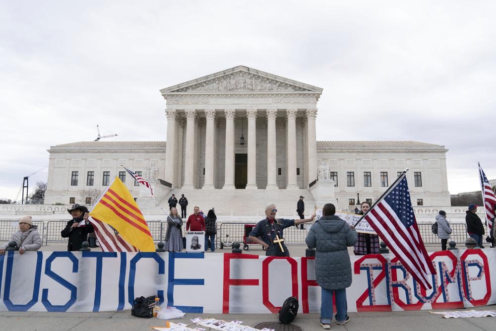 Supporters of former President Donald Trump protest outside of the Supreme Court on the second anniversary of the Jan. 6, assault on the U.S. Capitol, in Washington, Friday.