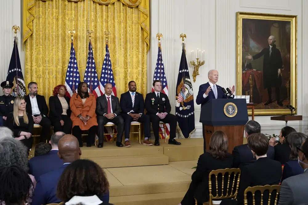 President Joe Biden speaks in the East Room of the White House in Washington, Friday, during a ceremony to mark the second anniversary of the Jan. 6 assault on the Capitol and to award Presidential Citizens Medals to state and local officials, election workers and police officers for their "exemplary deeds of service for their country or their fellow citizens" in upholding the results of the 2020 election and fighting back the Capitol mob.
