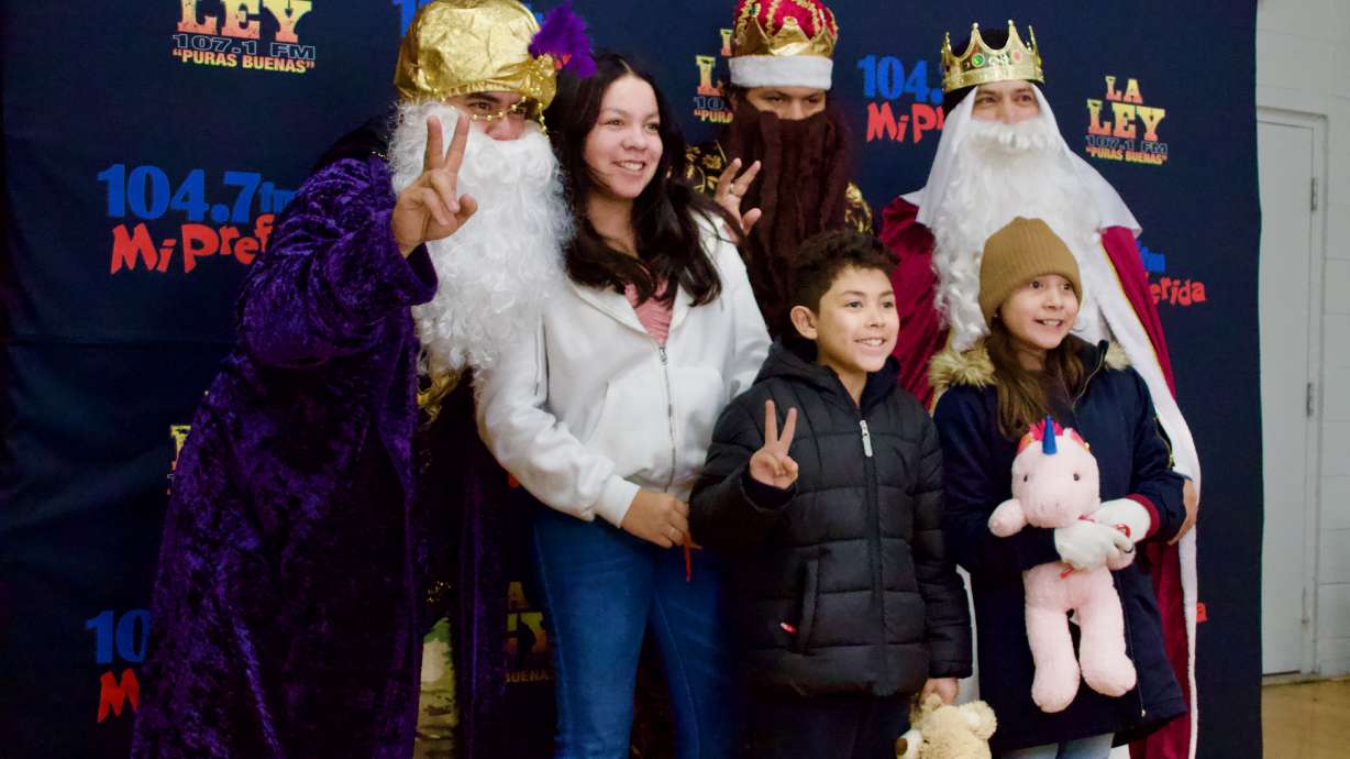A family takes a photo with the three wise men at a Día de los Reyes celebration at Centro Civico Mexicano in Salt Lake City on Friday. The organization has been hosting these celebrations on and off for the past 80 years, and an estimated 500 individuals attended the center's event Friday.