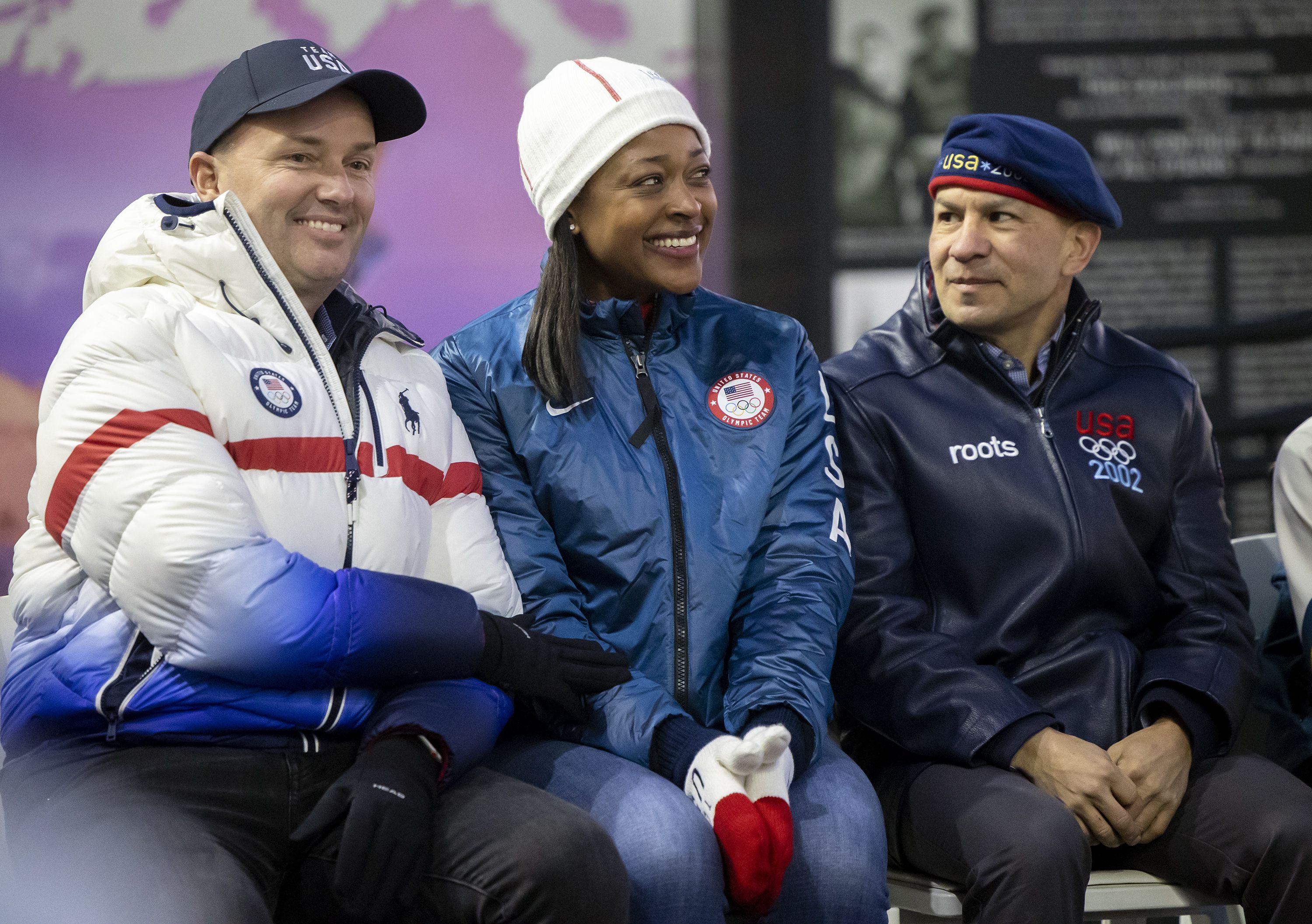 Gov. Spencer Cox sits with Vonetta Flowers, 2002 Olympic bobsled gold medalist, and Derek Parra, 2002 Olympic speedskating gold medalist, at a lighting ceremony for the Olympic Cauldron, marking the 20-year anniversary of the Salt Lake 2002 Olympics opening ceremony at Rice-Eccles Stadium at the University of Utah in Salt Lake City on Tuesday, Feb. 8, 2022.