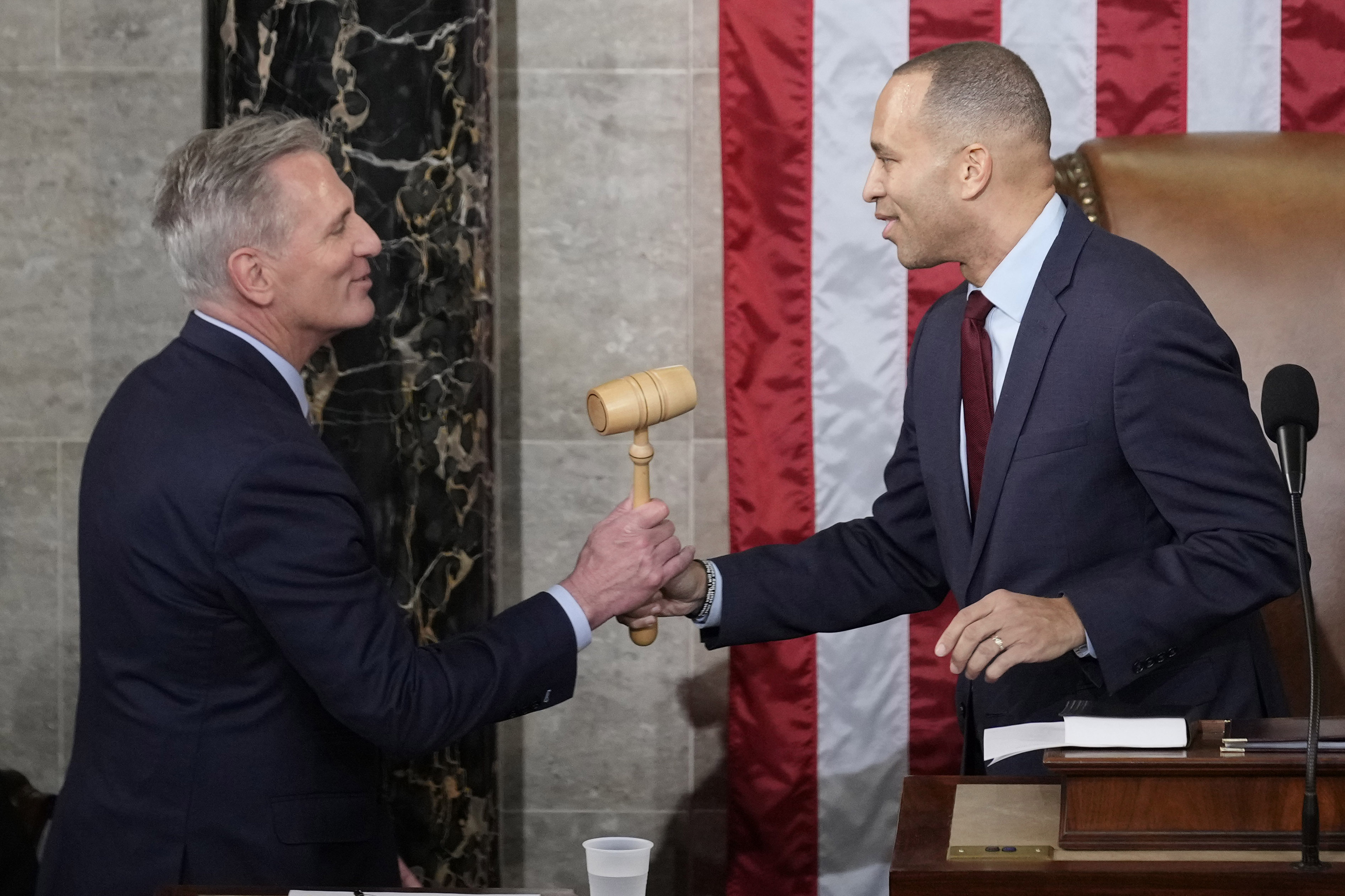 Incoming House Speaker Kevin McCarthy of Calif., receives the gavel from House Minority Leader Hakeem Jeffries of N.Y., on the House floor at the U.S. Capitol in Washington, early Saturday.