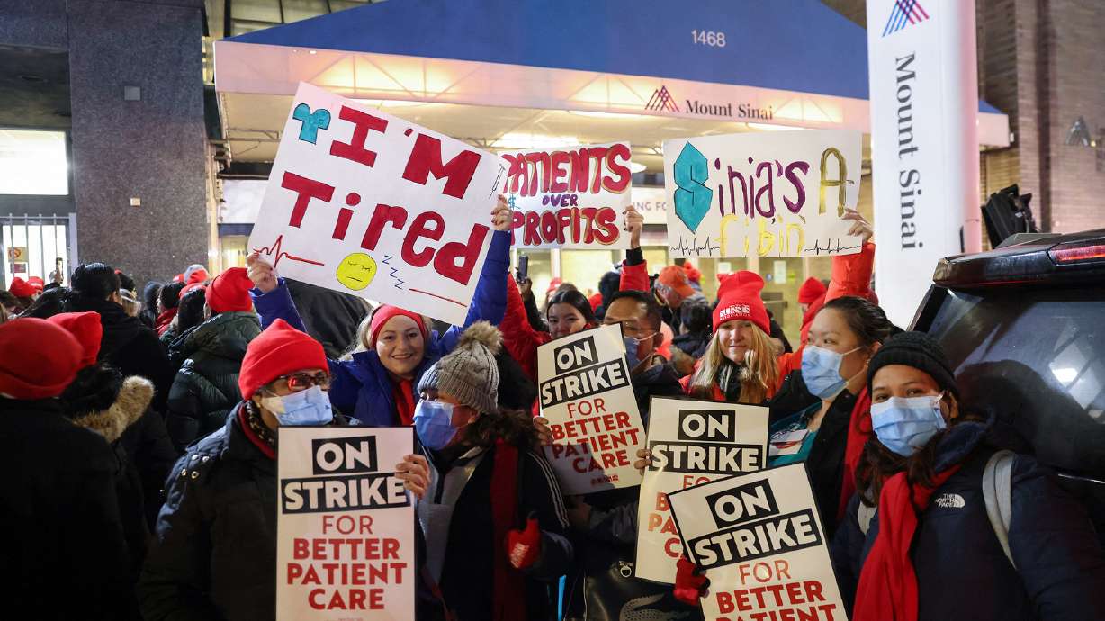 Nurses on the picket lines at Mount Sinai hospital in New York City early Monday. More than 7,000 nurses at two major New York City hospitals walked off the job.