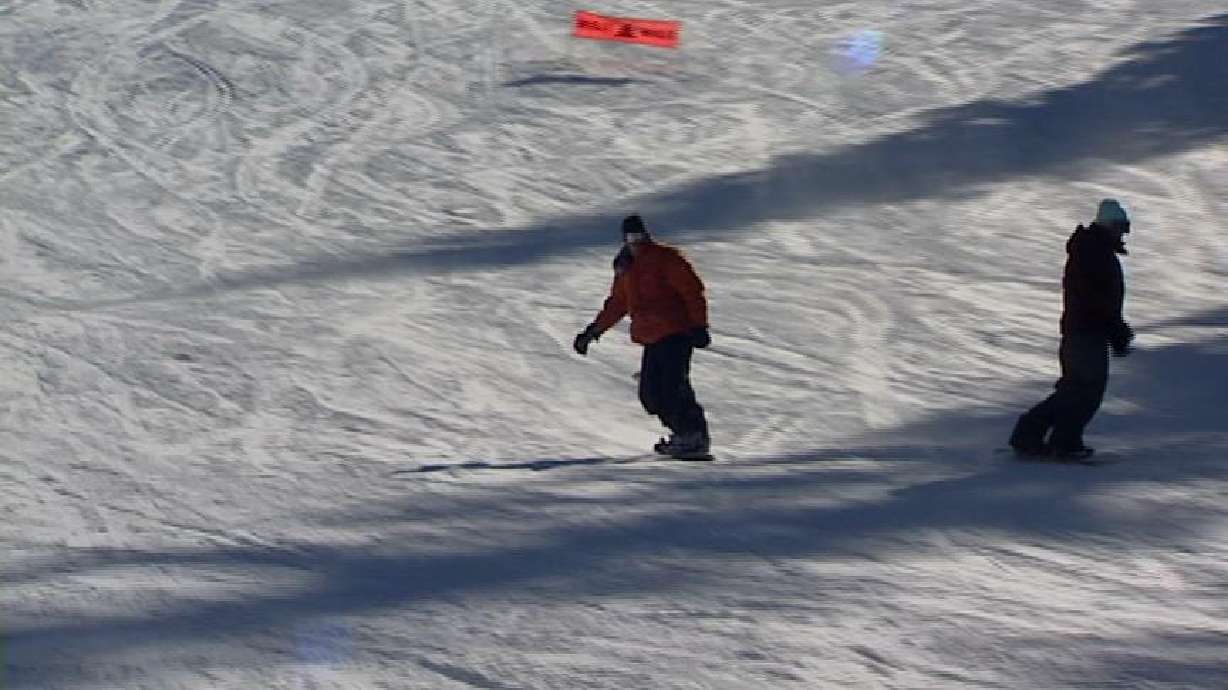 Skiers and Snowboarders Excited About Snow in the Mountains