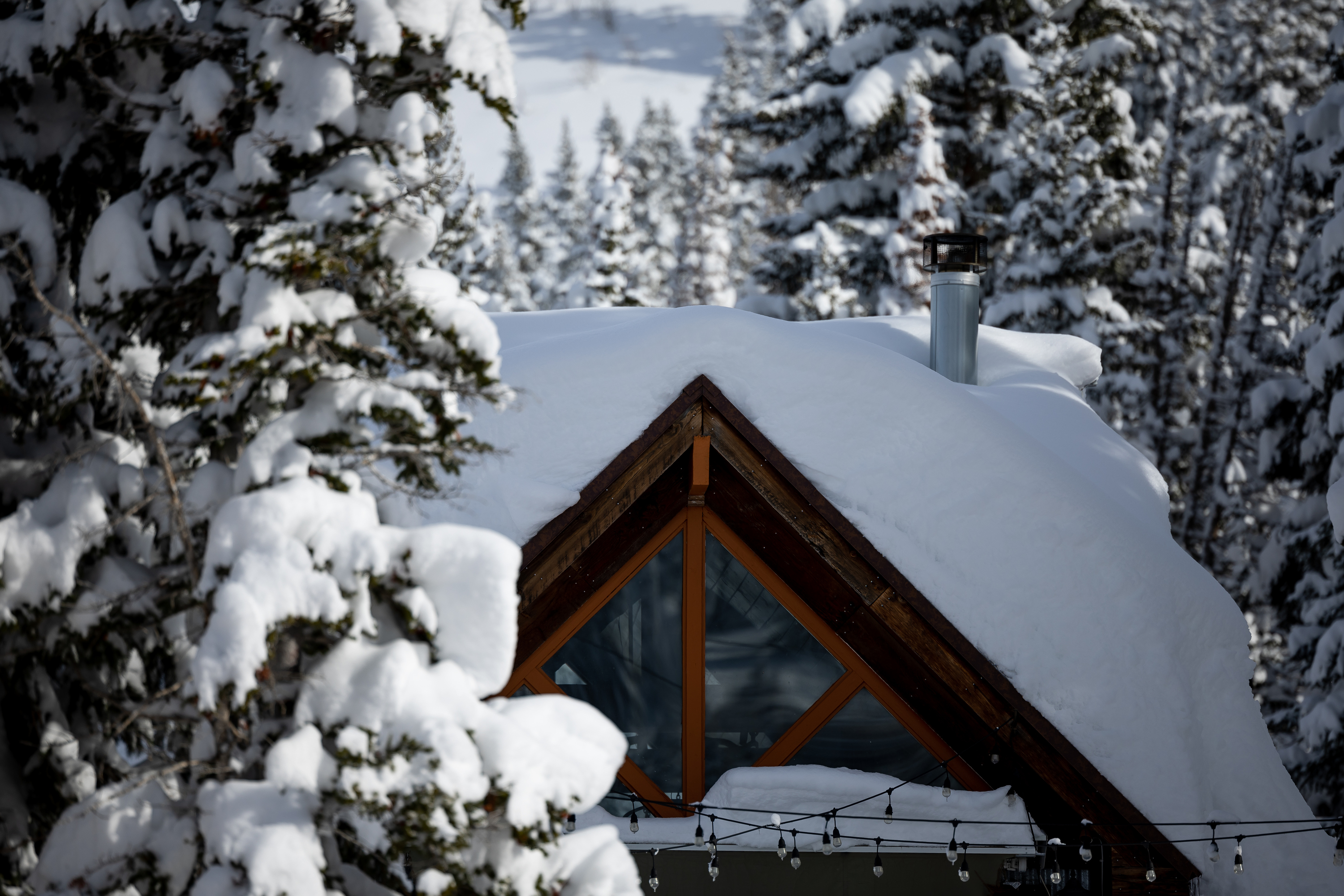 A home is covered in deep snow in Big Cottonwood Canyon on Wednesday. Another storm may produce another 2 feet of snow in the canyon area between Monday and Wednesday, meteorologists say.