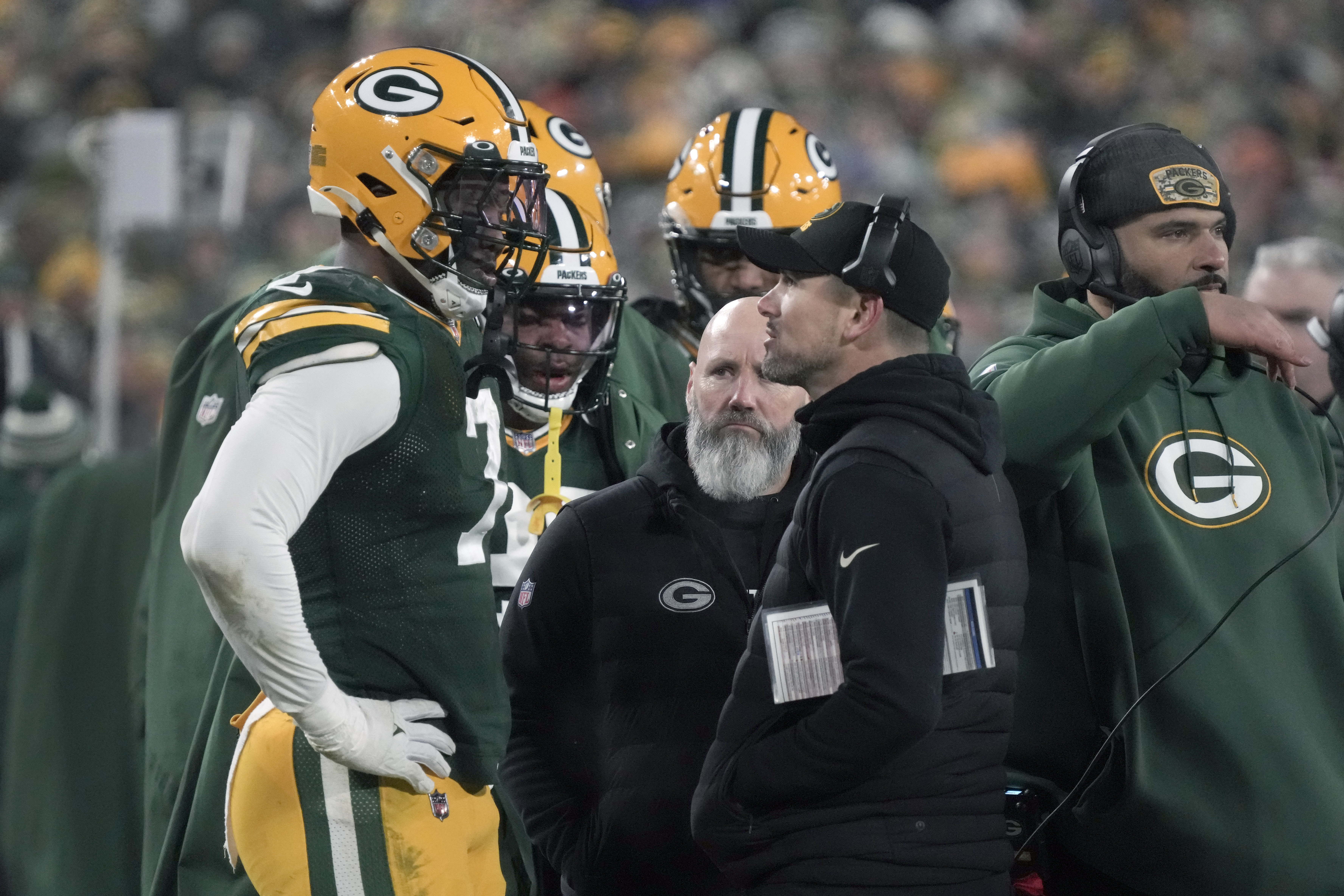 Green Bay Packers head coach Matt LaFleur talks to linebacker Quay Walker, left, after Walker was ejected during the second half of an NFL football game against the Detroit Lions Sunday, Jan. 8, 2023, in Green Bay, Wis.