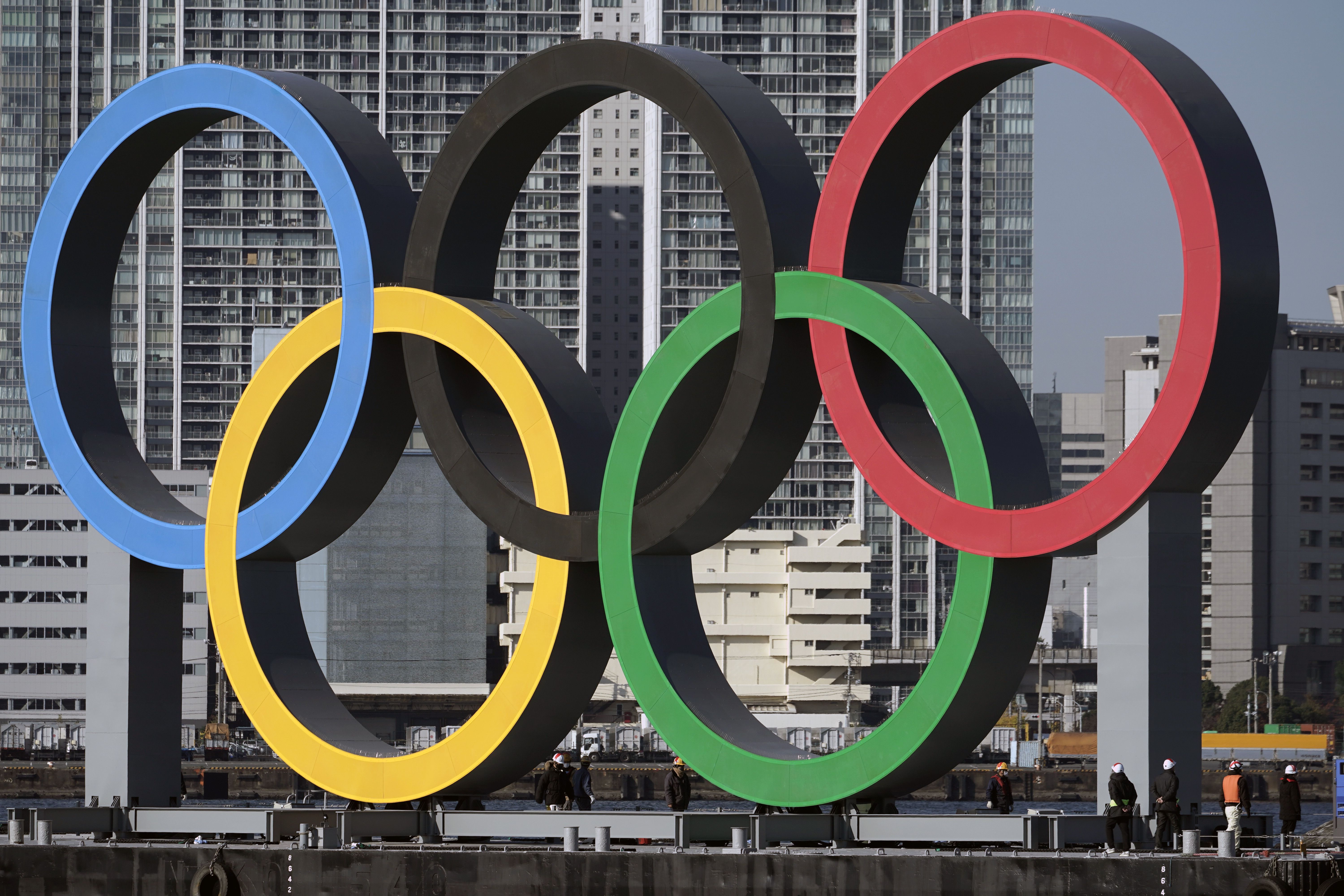 The Olympic rings are reinstalled after being taken down for maintenance on Dec. 1, 2020, ahead of the postponed Tokyo 2020 Olympics. More than two-thirds of Sapporo residents oppose the Japanese city's now-paused bid for the 2030 Winter Games.