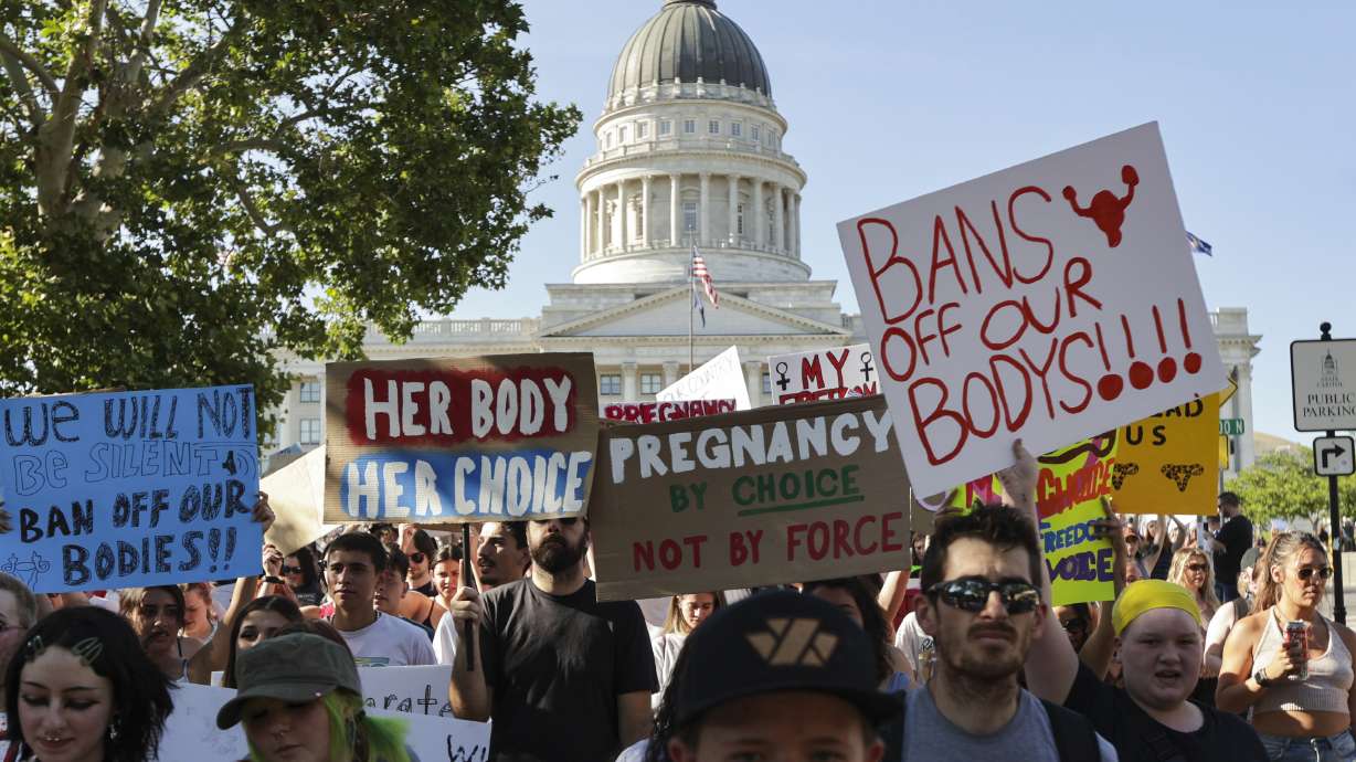 Hundreds of protesters walk from the Capitol to Washington Square in Salt Lake City, June 26, 2022, following the Supreme Court overturning of Roe v. Wade.