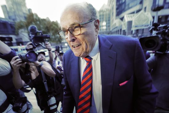 Rudy Giuliani arrives at the Fulton County Courthouse on Aug. 17, 2022, in Atlanta. The special grand jury investigating whether then-President Donald Trump and his allies committed any crimes while trying to overturn his defeat has finished its work. The judge overseeing the panel issued an order Monday dissolving the special grand jury.
