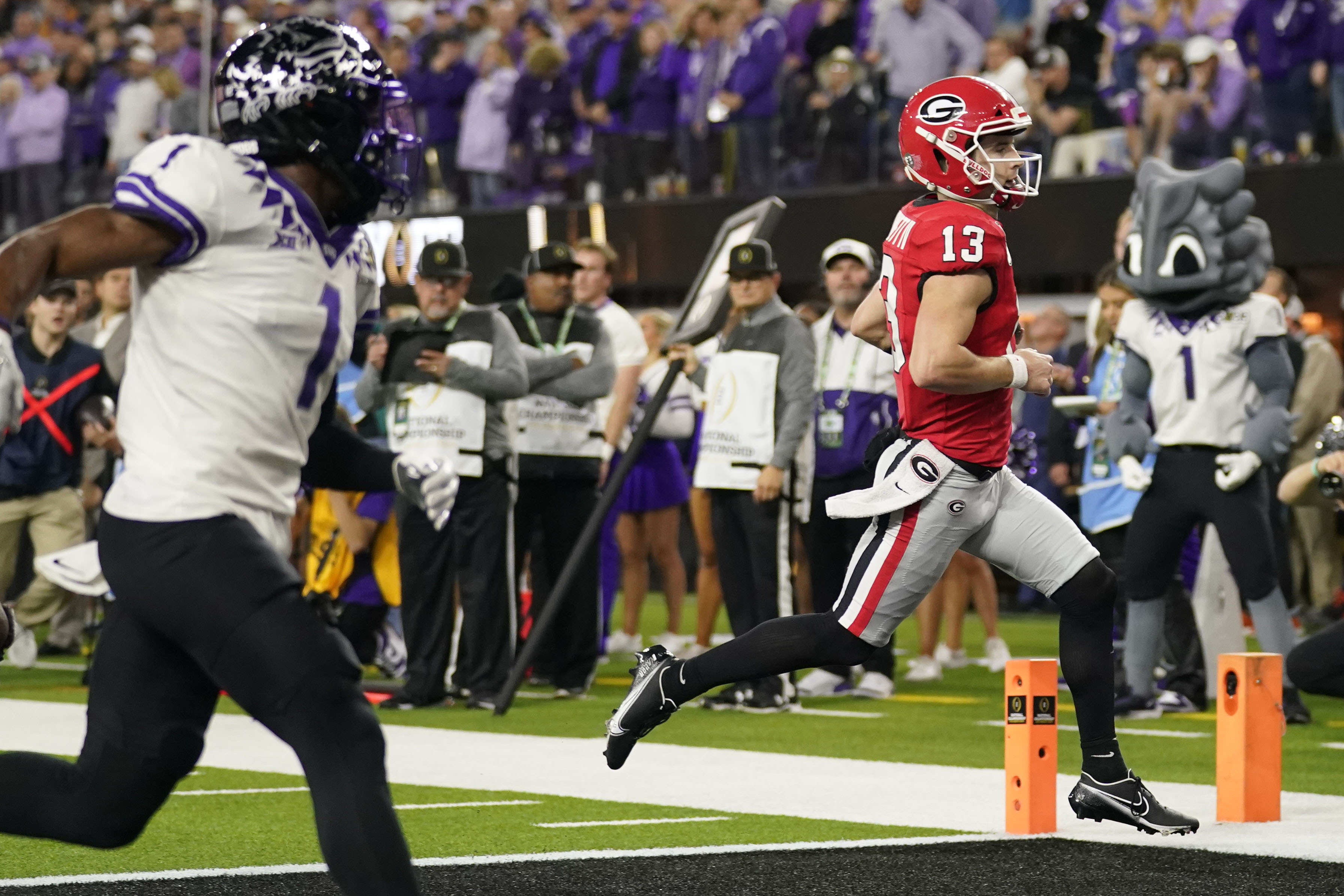 Georgia quarterback Stetson Bennett (13) runs into the end zone for a touchdown against TCU during the first half of the national championship NCAA College Football Playoff game, Monday, Jan. 9, 2023, in Inglewood, Calif. 