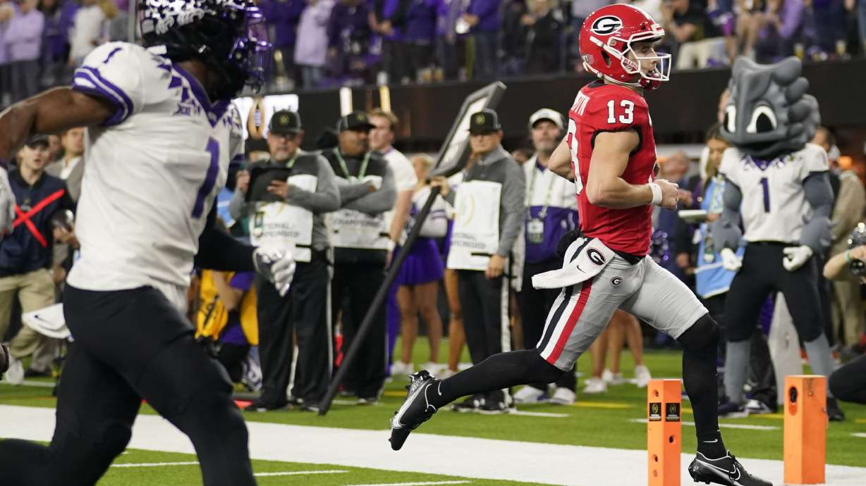 Georgia quarterback Stetson Bennett (13) runs into the end zone for a touchdown against TCU during the first half of the national championship NCAA College Football Playoff game, Monday, Jan. 9, 2023, in Inglewood, Calif.