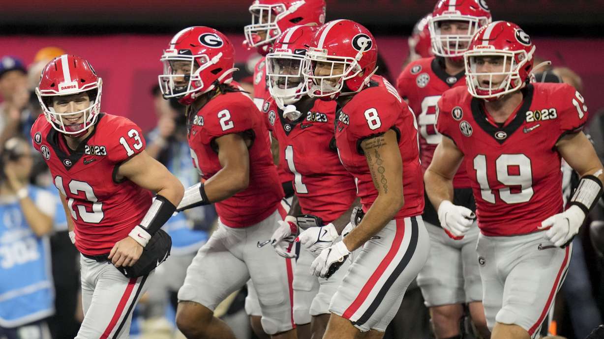 Georgia quarterback Stetson Bennett (13) celebrates hos touchdown against TCU during the first half of the national championship NCAA College Football Playoff game, Monday, Jan. 9, 2023, in Inglewood, Calif.