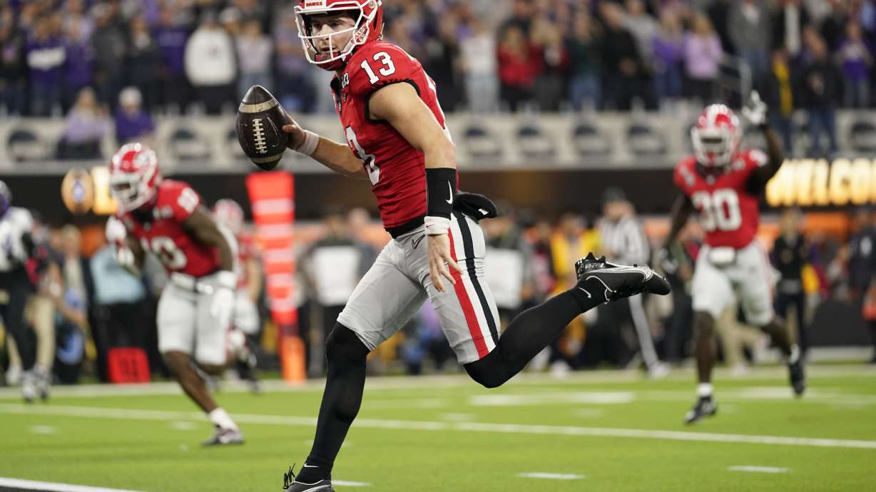 Georgia quarterback Stetson Bennett (13) runs into the end zone for a touchdown against TCU during the first half of the national championship NCAA College Football Playoff game, Monday, Jan. 9, 2023, in Inglewood, Calif.